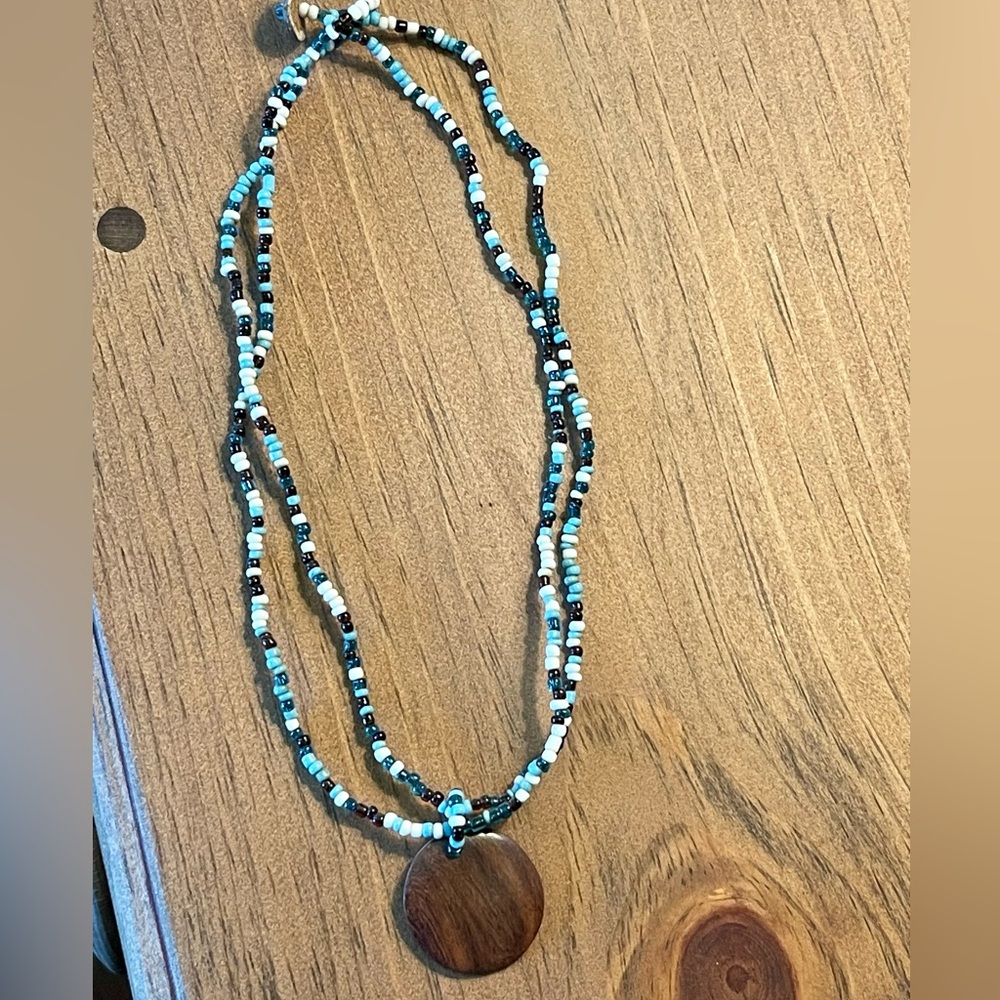 Beaded necklace with wooden pendant